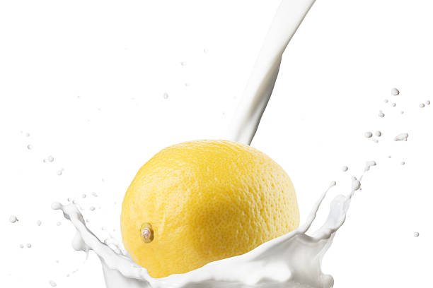 Milk Pour on Milk Splash With Lemon Fruits