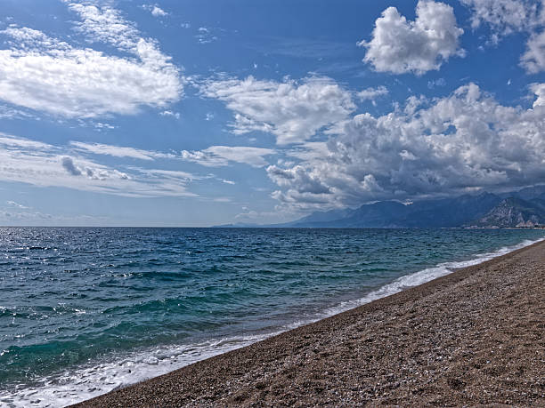 panoramic sea view beneath fluffy cloud formations