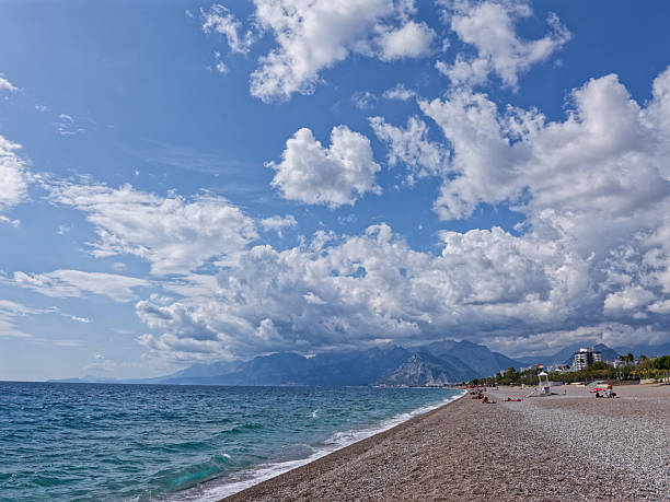 Antalya, Turkey - October 03, 2025: Autumn view of Antalya's Konyaalti beach and clouds
