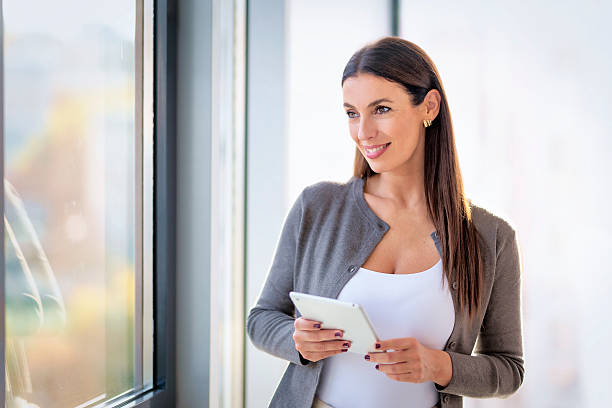istock Professional woman smiling in a modern office 2239776166
