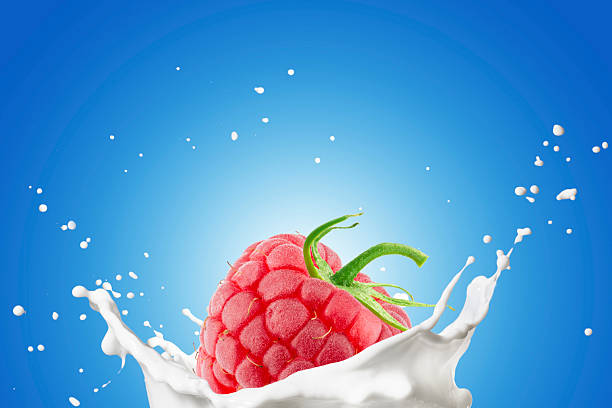 istock Milk Pour on Milk Splash With Raspberry Fruits 2239776496