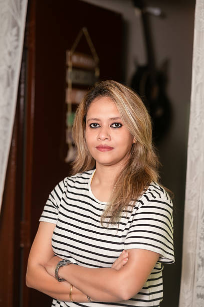 istock Empowered Woman Standing Indoors with Determined Expression 2239776653