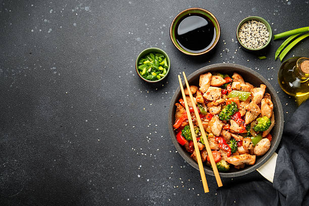 istock Chicken stir fry with vegetables and sesame. 2239778331