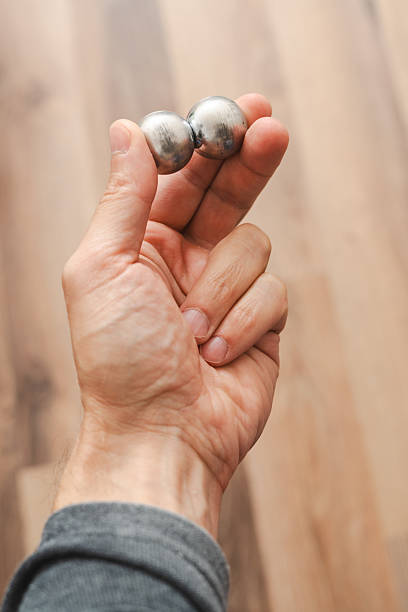 istock A man's hand with CNC spheres in daylight 2239783003
