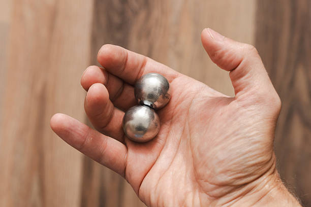 istock A man's hand with CNC spheres in daylight 2239783116