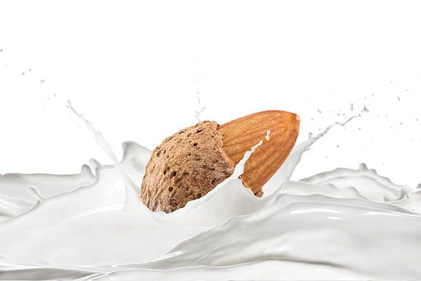 istock Milk Splash with Fresh Almond and Nuts 2239785280