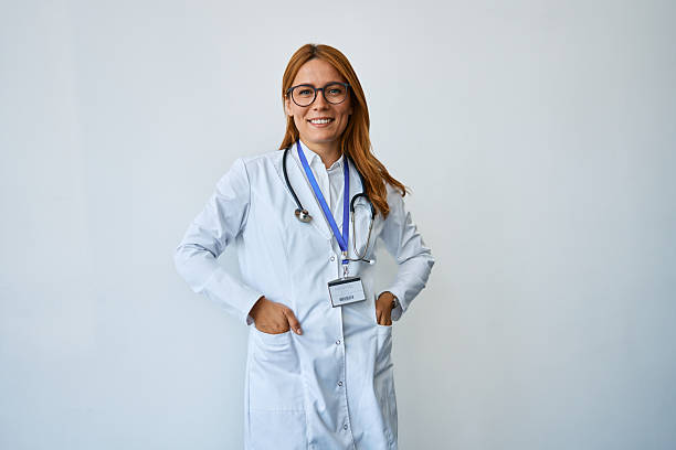 istock Smiling female doctor wearing glasses posing confidently 2239785758