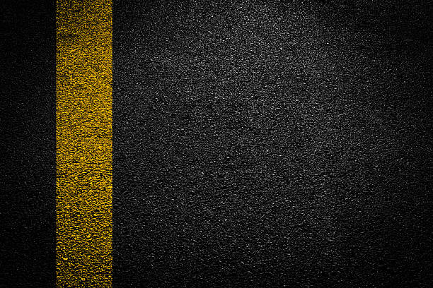 istock White And Yellow Stripes On Asphalt Road Texture. 2239786821