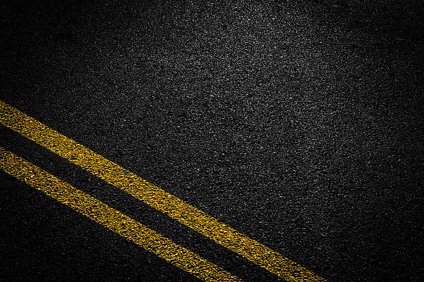 istock White And Yellow Stripes On Asphalt Road Texture. 2239786823