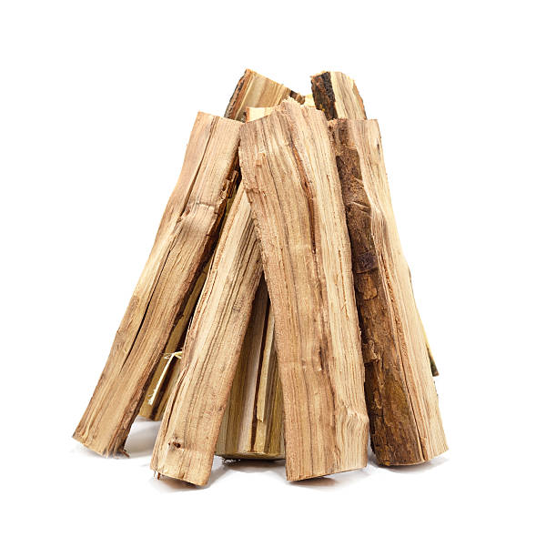istock Stack of firewood logs isolated on white background. 2239787384