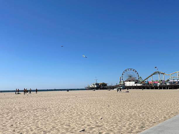 istock small airplane is flying above the beach, pulling an Israeli flag behind it. 2239787640