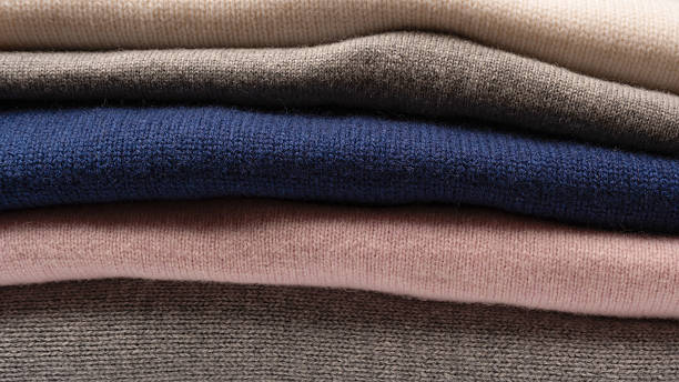 istock A group of warm sweaters isolated on a white background. 2239789887