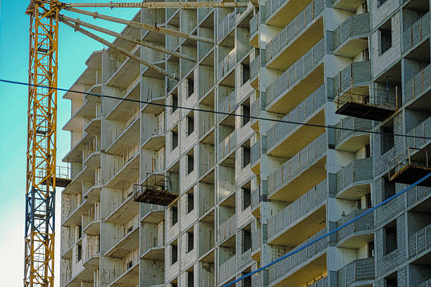 istock A Modern Construction Site Featuring a Crane A New Residential Building is Currently Under Development 2239792220