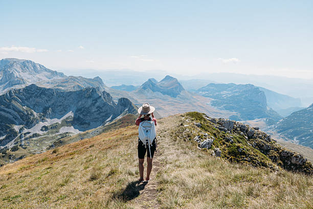 istock Woman Hiking Trail with Mountain View 2239792956