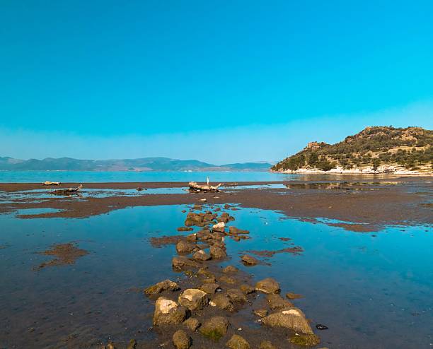 istock Tranquil coastal landscape with rocky shoreline. 2239793053