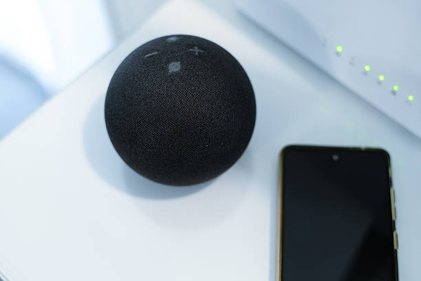 istock Smartphone, wifi speaker, router and computer on desk. Technology, domotics, home automation concept 2239794839