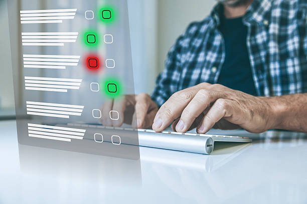 istock Man do online exam on virtual screen. Answer a survey filling out a tech form. Quiz, test concept 2239794859