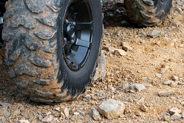 istock a big black wheel from an off-road car 2239795729