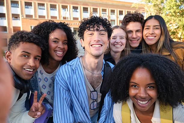 istock Happy university students taking a selfie together on campus 2239796002
