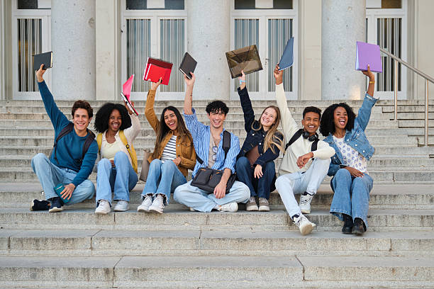 istock Cheering student group celebrating university education success 2239797263