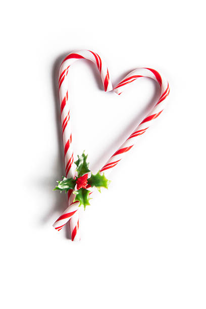 Heart of candy canes isolated on white background