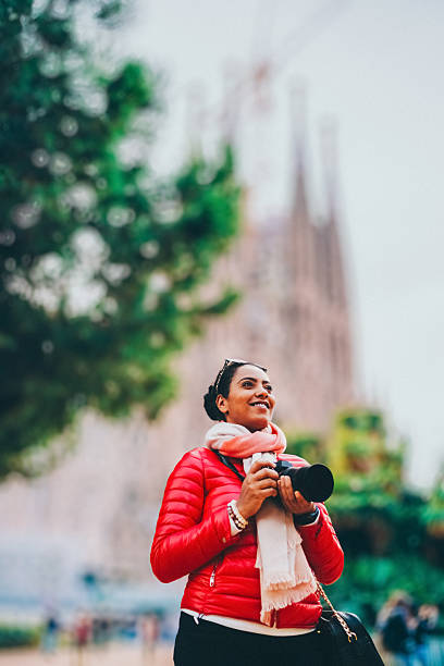 istock Tourist woman with camera exploring Bracelona 2239801031