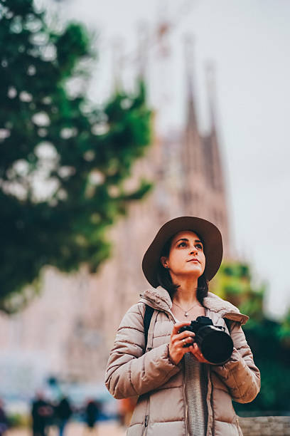 istock Tourist woman with camera exploring Bracelona 2239801221