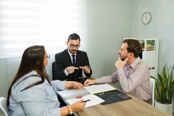 istock Lawyer conciliating couple discussing divorce agreement paperwork 2239803848