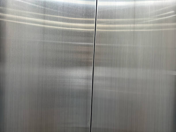 istock Shiny brushed stainless steel elevator door background 2239810079
