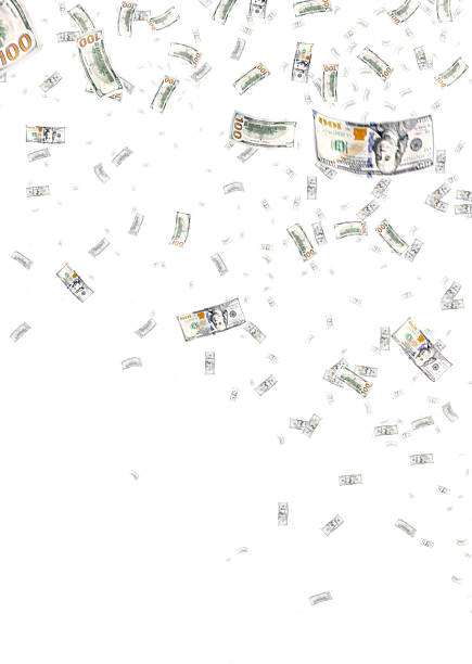 Money bills (US $100 banknotes) dance in the air against a bright blue background with falling water droplets creating a dynamic scene.