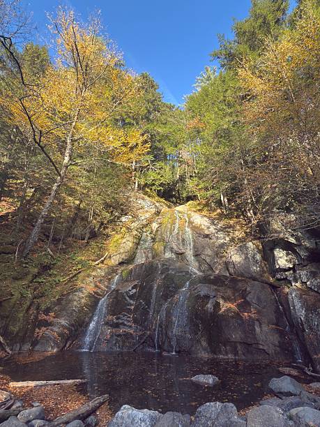 Water cascades over Glens Falls in the Green  Mountains in Granville Vermont in Autumn