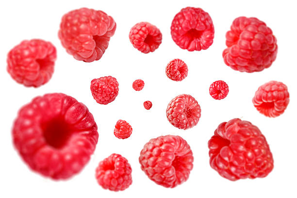 istock Fresh raspberries swirling in air against white background 2239818219