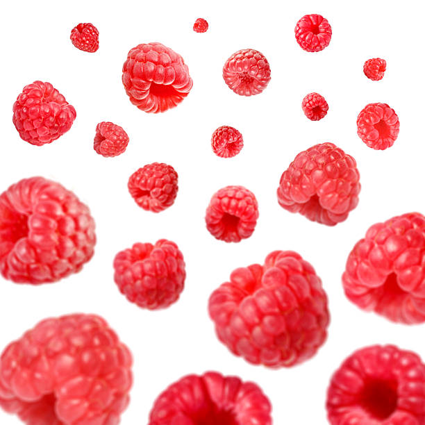 istock Fresh raspberries swirling in air against white background 2239818244