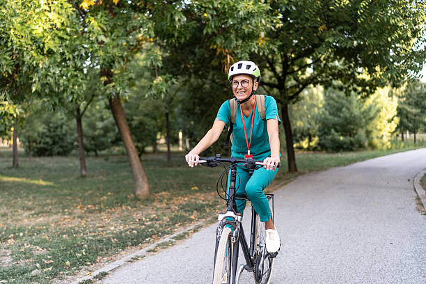 istock Nurse commuting to work by bicycle in park 2239818855