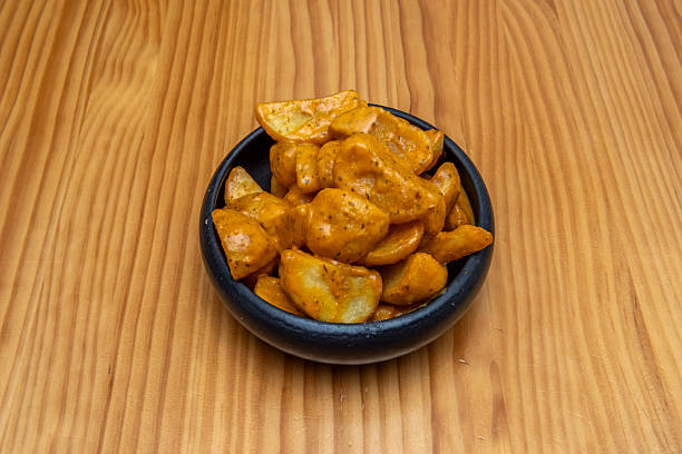 istock Patatas bravas are served hot as a tapa 2239820235