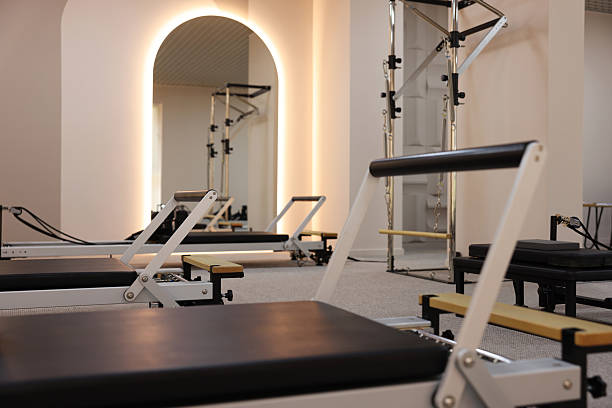 istock Reformer machines in studio, closeup. Pilates equipment 2239821019