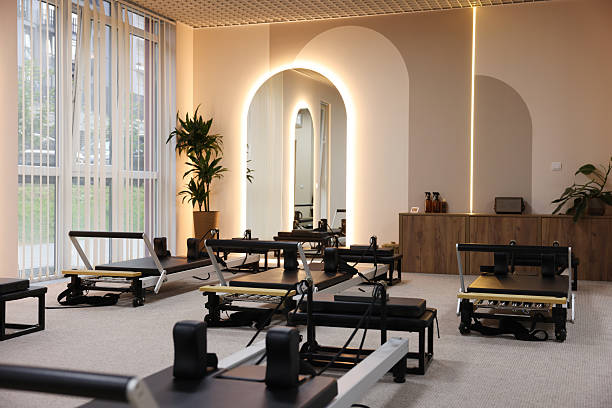 istock Many reformer machines in studio. Pilates equipment 2239821076