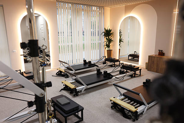 istock Many reformer machines in studio. Pilates equipment 2239821136