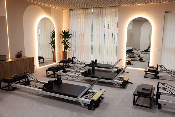 istock Many reformer machines in studio. Pilates equipment 2239821145