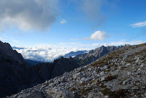 The crisp autumn air and deep blue sky frame a mountain summit overlooking Innsbruck. Captured at golden hour in the Tyrolean Alps. Keywords: Innsbruck summit, Tyrol autumn, alpine view, mountain peak, travel Austria.