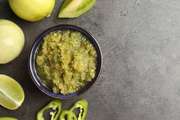 istock Delicious salsa sauce in bowl and products on grey textured table, flat lay. Space for text 2239829744