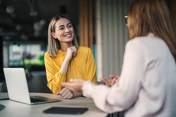 istock Happy insurance agent talking to her customer in the office 2239830445