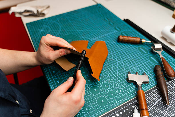 istock Leather burnishing creates polished edges that resist wear. Using a burnisher, artisans refine leather edges for durability and shine. Leather edge burnishing provides smooth, glossy finishing. 2239831093