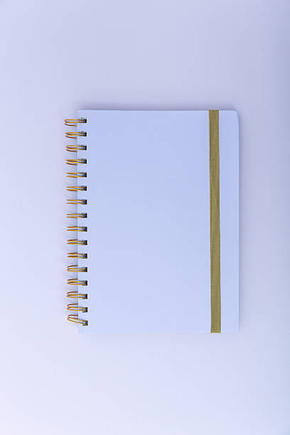 istock Lilac spiral notebook on clean violet desk. Image about simplicity, mindfulness and creative order. 2239831382