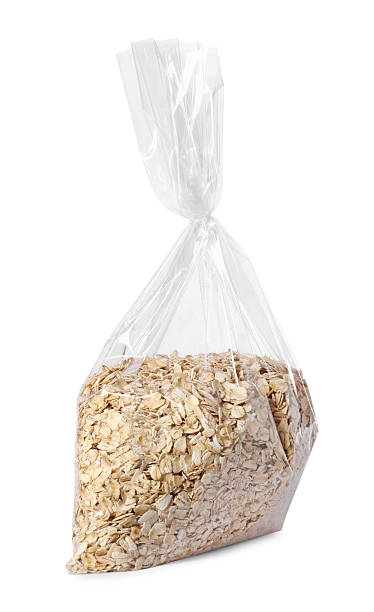istock Plastic bag with oat flakes isolated on white 2239831850