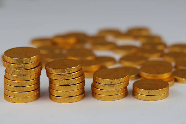 Gold coins stacked on each other in different positions isolated on white background.finance illustration.