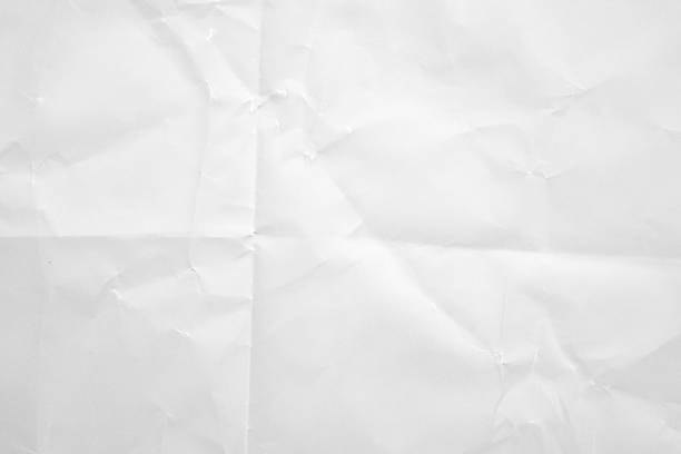 istock White folded and wrinkled paper texture background 2239843027