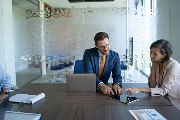 istock Business people working together using digital tablet in modern office 2239843062