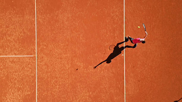 istock Tennis Player Executing Forehand Stroke on Clay Court 2239843541