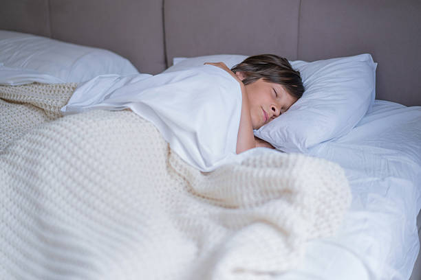 A child comfortably sleeping, capturing a moment of peace.
